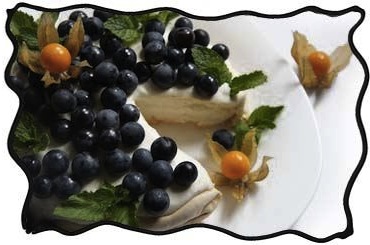 Pavlova cake with grapes and physalis