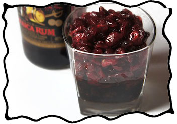 Soaking dried cherries in rum for the filling