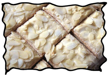 Angel food cake squares with almond slices