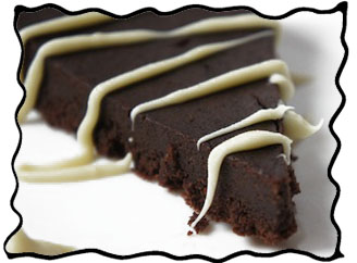 Slice of flourless dark chocolate cake